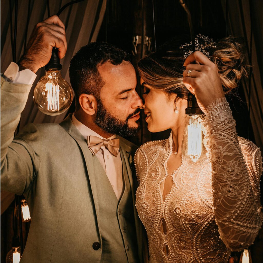 A couple photographed with warm, controlled lighting